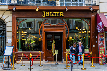 Couple outside restaurant Bouillon Julien on Rue Saint-Denis