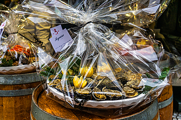 Plate of oysters wrapped in cellophane