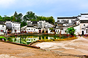 Central Bell Pond, with the land and pond in Yin Yang formation at Zhuge Bagua village, Lanxi County, Jinhua, Zhejiang Province, China. The 600 year old village is based on Chinese eight trigrams layout. Village buildings existed since the Ming Dynasty.