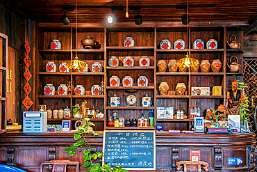 Shelves stack with tea and wine, Youbu Old Town, Lanxi County, Jinhua City, Zhejiang, China. Located at the intersection of 4 provinces, merchants have gathered here since the Ming Dynasty and is renowned for its 5a.m. morning tea (breakfast) culture.