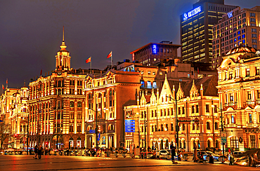 Magnificent view of brightly lit heritage buildings along the Bund at night, Shanghai, China