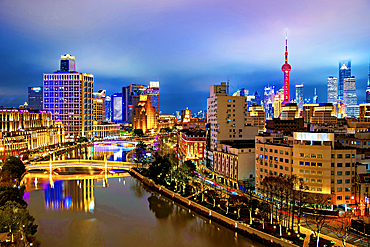 Shanghai city skyline and Suzhou Creek at night, Shanghai, China.