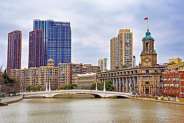 Suzhou Creek with the Shanghai Postal Museum (built in the 1920s) on the right, Shanghai, China