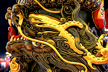 Exquisite carvings of dragons on the pillars at the temple of the Goddess of the Pearl, a local deity, in Puning City, Guangdong Province, China