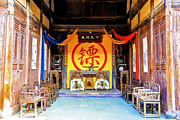 The hall of a traditional security service establishment, Nianbadu ancient town (since 878 AD), Jiangshan City, Zhejiang Province, China. Services are akin to modern day security companies, transporting valuables and providing protection services.