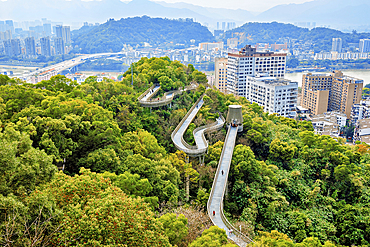 Fuzhou city view and FuDao (Fortune Walkway), Fuzhou, Fujian Province, China. FuDao is a picturesque 19km elevated walkway straddling several hills and parks in Fuzhou.
