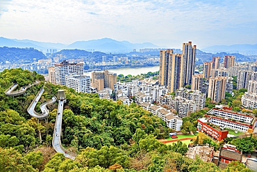 Fuzhou city view and FuDao (Fortune Walkway), Fuzhou, Fujian Province, China. FuDao is a picturesque 19km elevated walkway straddling several hills and parks in Fuzhou.