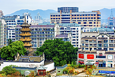 Fuzhou city view with the 'Wu' (dark) pagoda, Fuzhou, Fujian Province, China. The pagoda was first built in 799 AD (rebuilt 941 AD).