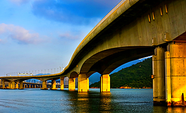 The Hong Kong–Zhuhai–Macau Bridge (HZMB), this 55 km bridge–tunnel system is the longest sea crossing and the longest open-sea fixed link in the world. It consist of three cable-stayed bridges, an undersea tunnel, and four artificial islands.