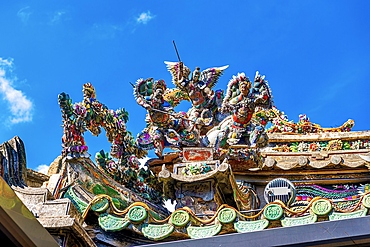 Intricate porcelain inlay sculptures on rooftops of the Mazu Palace, a Tianhou Temple built in 1879. Shantou, Guangdong Province, China