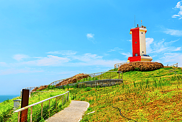 Red and white lighthouse at Little Weihai, a picturesque seaside fishing town in Shishi, Quanzhou, Fujian Province, China