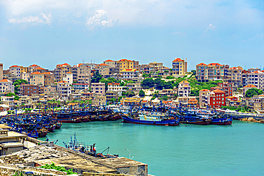 Fishing boats and trawlers at the bay in Little Weihai, a picturesque seaside fishing town in Shishi, Quanzhou, Fujian Province, China