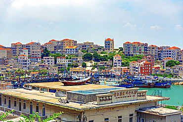 Fishing boats and trawlers at the bay in Little Weihai, a picturesque seaside fishing town in Shishi, Quanzhou, Fujian Province, China