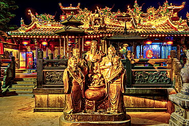 Bronze statues of the five Gods of Wealth at Guandi Temple at night. Quanzhou: Emporium of the World (UNESCO World Heritage), Fujian Province, China