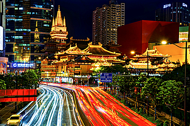 JingAn Temple at night, Shanghai, China. First built in 247 A.D. it moved from its original location beside Suzhou Creek to its current location in 1216. The temple existed before Shanghai was founded in 1291.