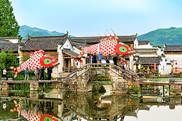Village parade of giant fish lanterns, Chengkan Ancient Village, Huangshan City, Anhui, China. The village was established 1800 years ago by the Luo family clan. It has buildings dating as early as the Song Dynasty (960 to 1279 AD).