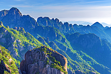 Misty mountain scapes of Huangshan (Mt Huang/Yellow Mountain), UNESCO World Heritage and UNESCO Global Geopark, Anhui Province, China.