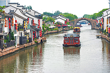 Water taxis in Wuxi City, Jiangsu, China. Multiple rivers run through the city which is common feature of some cities in this region that also include Suzhou.