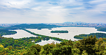 Full view of the West Lake, Hangzhou, Zhejiang Province, China. UNESCO World Heritage Site since 2011. It is a tourist attraction since the Tang Dynasty (618-907), its natural beauty and relics have inspired poets and painters throughout Chinese history.