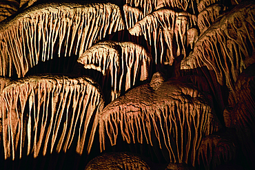 Background with Stalactites and stalagmites in the Sorek Cave in Israel