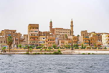 Egyptian town and mosque along the banks of Nile River, Egypt