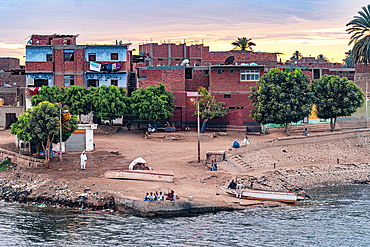 Children on shore of Nile River in a traditional village, Egypt