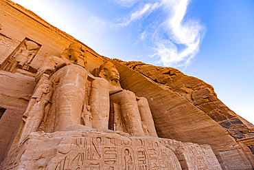 Low angle view of majestic statues on facade of the Temple of Ramses II, Abu Simbel, Aswan, Egypt