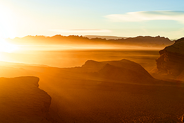 Idyllic sunrise over volcanic rock formations and mountains in the surreal Labyrinth Desert, Puna, Argentina