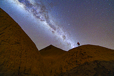 Man looking at the Milky Way, Devil's Desert, Puna, Salta, Argentina