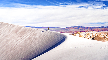 Tourist photographing the white dunes, Campo de Piedra Pomez, El Penon, Puna, Catamarca, Argentina. (MR)