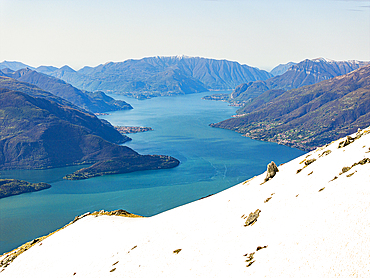 Snowy mountains overlooking Lake Como, Alto Lario, Como province, Lombardy, Italy
