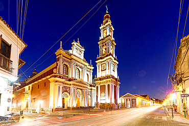 Lights of car trails at dusk on an empty road near Saint Francis church, Salta, Argentina