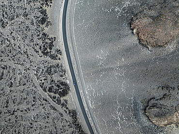 Car on a winding road in volcanic desert, Antofagasta de la Sierra, Puna, Catamarca, Argentina