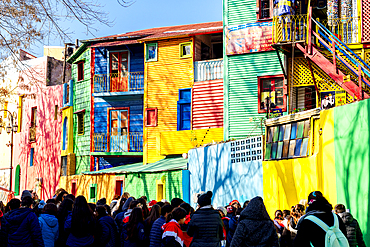 Tourists exploring the colorful houses of Caminito, La Boca, Buenos Aires, Argentina
