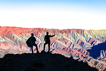 Silhouette of tourists at sunset, Serrania de Hornocal, Humahuaca, Jujuy, Argentina