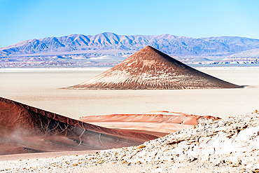 Surreal Arita Cone natural formation (Cono De Arita) at sunset, Salar de Arizaro salt flat, Puna, Argentina