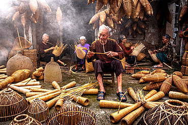 Local people crafting traditional bamboo fish traps, Hanoi, Vietnam. (MR)