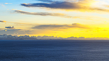 Sunset over the blue Norwegian Sea, Henningsvaer, Lofoten Islands, Norway