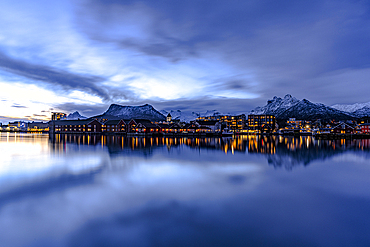 Svolvaer town reflected in the sea at dusk, Vagan, Nordland, Lofoten Islands, Norway