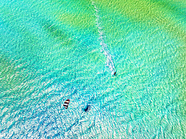 Overhead view of a kite surfer in the idyllic lagoon at Sotavento beach, Jandia, Fuerteventura, Canary Islands, Spain