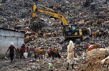 Municipality excavator working at a garbage dumping site on May 27, 2025 in Guwahati, India.