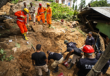 National Disaster Response Force (NDRF) personnel busy in rescue operations after a major landslide, triggered by a heavy downpour, on June 7, 2025 in Guwahati, India.
