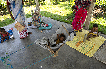 Daycare workers take care of babies and children in a shelter at a Tea Estate, as their mother busy in harvesting tea leafs, in Assam, India on June 12, 2025.