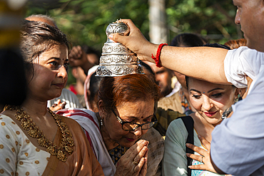 Hindu devotee takes blessings as they takes part in Rath Yatra religious procession Guwahati, India on June 27, 2025. Rath Yatra, also known as the Chariot Festival, is a major Hindu festival celebrated in India.