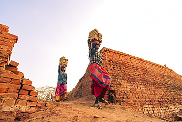 Women labourers working in a brick factory in Assam, India
