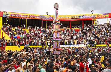 People from the Pnar community march in a circle around a Rot as they celebrate an event organised to mark the Behdienkhlam festival in Jowai, India, on July 14, 2025.