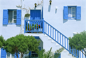 Close-up of traditional white house with blue railings, door and shutters on Mykonos, Cyclades Islands, Greek Islands, Greece, Europe