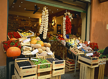 Vegetable shop selling garlic, olives and squash, in the market in Bologna, Emilia Romagna, Italy, Europe