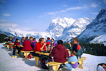 People take a break from skiing in mountain top bar, Wengen, Bernese Oberland, Switzerland, Europe