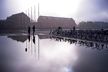 Bicycles reflected in still water, Christians Brygge, Copenhagen, Denmark, Scandinavia, Europe